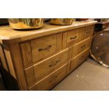 A modern oak multi-drawer long & low chest