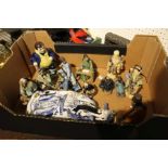 A box containing a collection of Oriental figurines