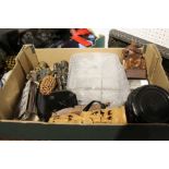 A box containing collectable figurines, miniature display cabinets, etc.