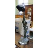 an art nouveau table lamp in the form of a maiden.