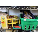 A toy Fisher Price garage with accessories and assorted Tonka toys etc.