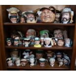 A large collection of Royal Doulton character jugs.