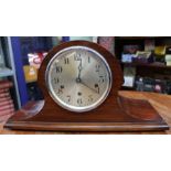 A mahogany Napoleons hat chiming mantel clock.