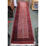 A Persian design carpet runner, red ground, 337cm x 78cm
