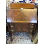 An early 20th century bureau with fitted interior, burr walnut front.