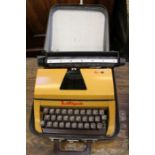 A tartan cased Lilliput manual typewriter.