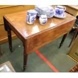 A 19th century mahogany Pembroke table with cushion fronted cutlery drawer.