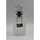 George Betjemann & Sons, a late Victorian silver mounted locking square cut glass spirit decanter, L