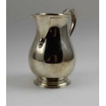 A Georgian design silver cream jug, baluster form with sparrow beak rim, Birmingham 1966, 143g