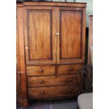 A 19th century mahogany linen press of typical form and construction with try fitted cupboard.