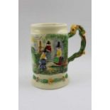 A Crown Devon pottery musical tankard, hand painted decoration,