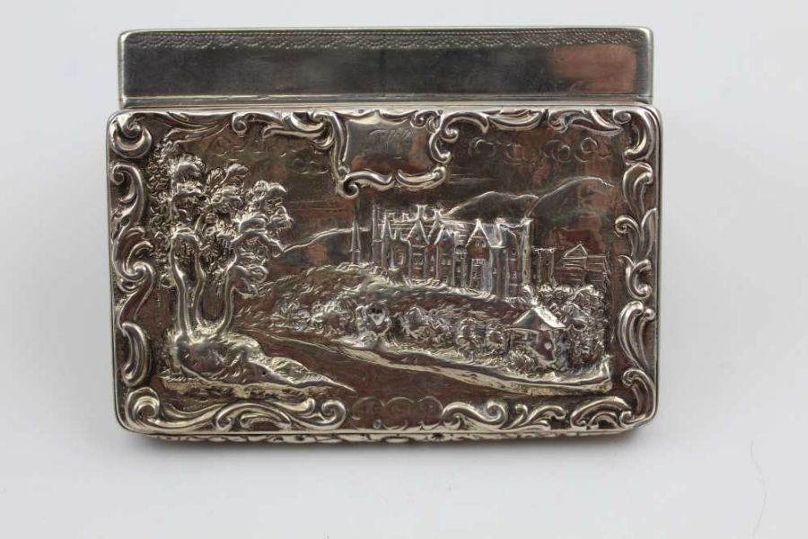 A William IV silver snuff box, the hinged cover decorated with a raised image of a grand country hou - Image 2 of 4