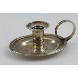 Charles Rawlings, A George IV silver small chamber or taper stick holder, oval base with ring handle