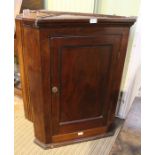 A Georgian mahogany plain hanging corner cupboard. 91 cm high.