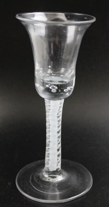 A possibly Dutch wine glass, with bell shaped bowl, cotton twist stem, on circular platform foot