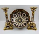 A pair of Royal Crown Derby bone china candlesticks, decorated and gilded in the Imari palette No. 1