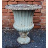 A Regency design cast iron Campana form urn, with egg & dart rim over a fluted waisted body on outsw