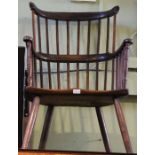 A 19th century provincial double comb back open armchair.