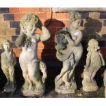 Four various cast concrete garden statues.