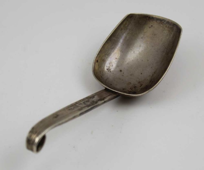 A Russian silver caddy spoon, scroll tip handle, chased decoration, bears "84" mark