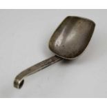 A Russian silver caddy spoon, scroll tip handle, chased decoration, bears "84" mark