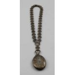 A Victorian silver locket, fancy link chain, with engraved alternate links, the pendant locket of ov