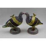 A pair of 20th century Continental Faience glazed pottery pigeon form tureens