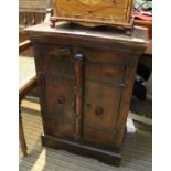 A possibly Indian hard wood two door side cabinet. 70 x 50 cm.