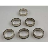 A set of six late Victorian silver napkin rings, fluted edges, Birmingham 1900, combined weight: 89g