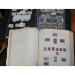 Quantity of stamps in a green & red stockbook