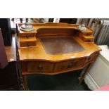 A reproduction yew wood writing desk