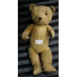A vintage plush jointed bear with leather pads