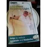 An LED brass floor reading light by "Coopers", brand new still boxed.