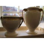 A pair of modern ceramic cream & gilt pots