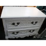 A Continental design white painted fancy chest of two drawers