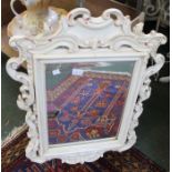 A white painted fancy framed mirror