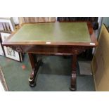 A regency rosewood writing table with concealed single drawer on plain supports with tulip turned st