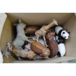 A mixed box of wooden model animals, elephants, pandas, giraffe etc.