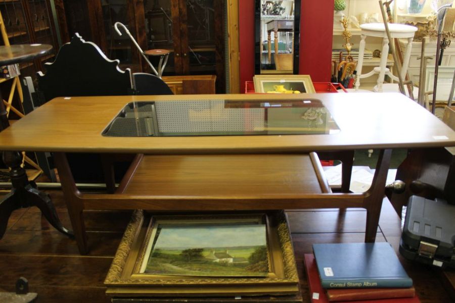 A retro Schreiber coffee table with under tier with smoked glass top inset.