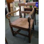 A 19th century armchair, double bar back with solid seat