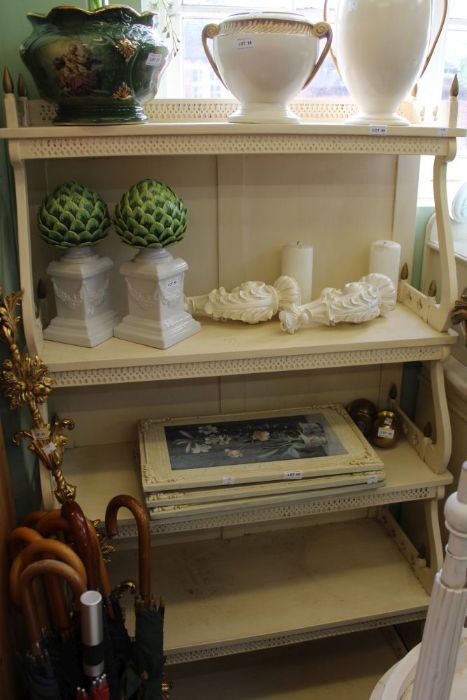 A white waterfall bookcase