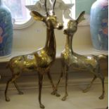 Two large brass deer figures