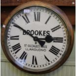 A single fusee wall clock, dial inscribed "Brookes Ltd, St. George's Place, Llandudno", with pendulu