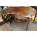 A 19th century mahogany kidney shaped table