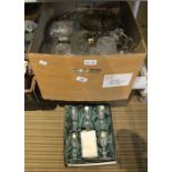 A box of assorted glass ware includes two ceiling shades.