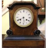 A wooden mantel clock