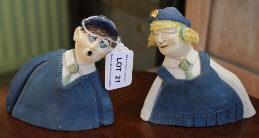 A pair of Studio pottery figures, a school girl and boy, monogrammed