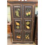 A fruit painted black two door cupboard