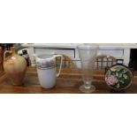 A Laura Ashley glass vase with a large pottery water jug, a floral vase and a terracotta vessel.