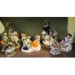 A shelf of figurines to include Victorian Staffordshire